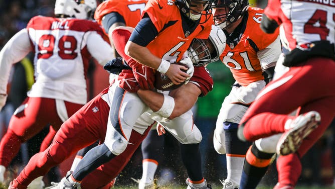 J.J. Watt of the Arizona Cardinals sacks Brett Rypien of the Denver Broncos.