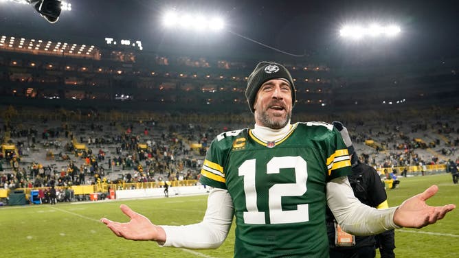 Aaron Rodgers walks off the field after defeating the Los Angeles Rams at Lambeau Field in Green Bay, Wisconsin.