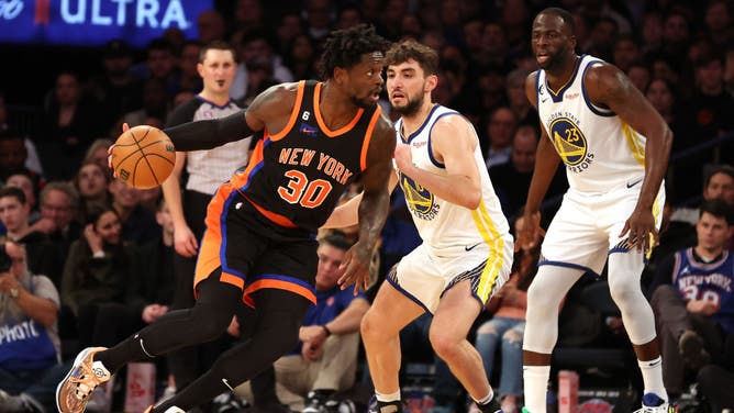 New York Knicks Julius Randle posts up Golden State Warriors G Ty Jerome at Madison Square Garden.