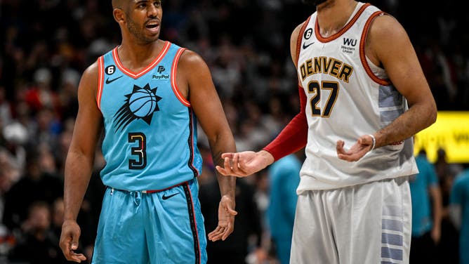 Denver Nuggets PG Jamal Murray and Phoenix Suns PG Chris Paul jaw during overtime  at Ball Arena in Denver on Christmas, 2022.