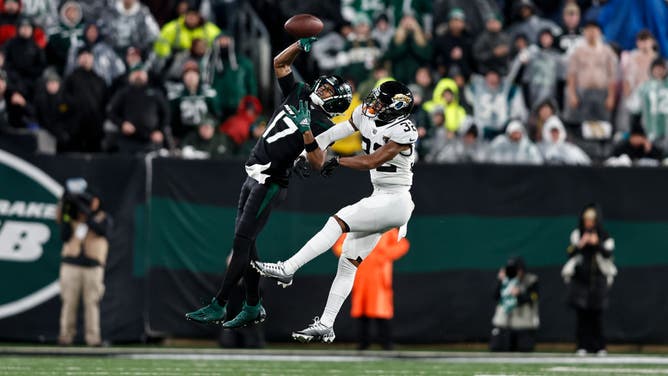 Jets WR Garrett Wilson goes up for a one-hand catch against the Jacksonville Jaguars at MetLife Stadium in East Rutherford, New Jersey.