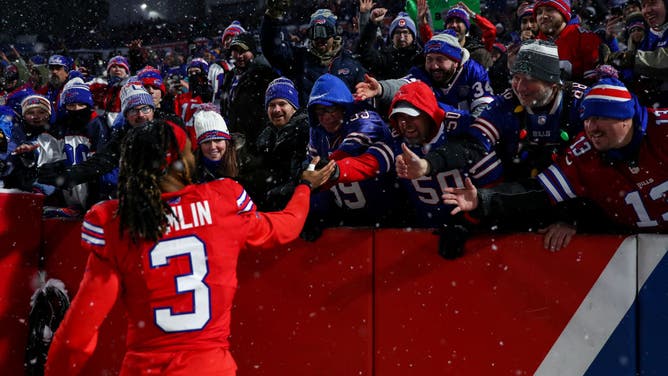 Damar Hamlin #3 of the Buffalo Bills celebrates with fans after an NFL football game against the Miami Dolphins at Highmark Stadium on December 17, 2022 in Orchard Park, New York.