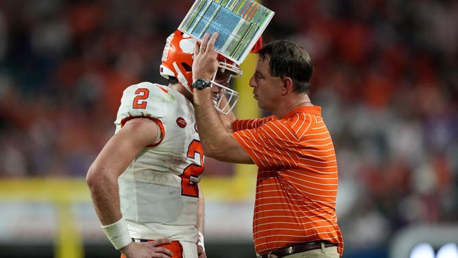 Clemson coach Dabo Swinney talks with QB Cade Klubnik after a play vs. the Tennessee Volunteers in the Capital One Orange Bowl at Hard Rock Stadium in Miami.