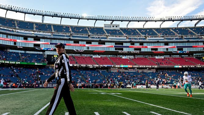 NFL down judge Sarah Thomas looks on before a game between the Miami Dolphins and the New England Patriots.