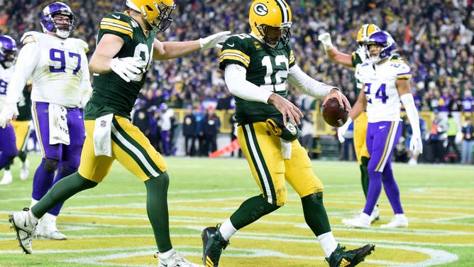 Green Bay Packers' Aaron Rodgers celebrates with TE Tyler Davis after running for a 2-yard TD against the Minnesota Vikings at Lambeau Field in Green Bay, Wisconsin.