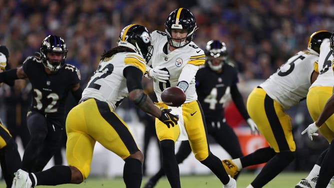 Pittsburgh Steelers QB Kenny Pickett hands the ball off to Steeler RB Najee Harris against the Baltimore Ravens at M&T Bank Stadium in Baltimore, Maryland.