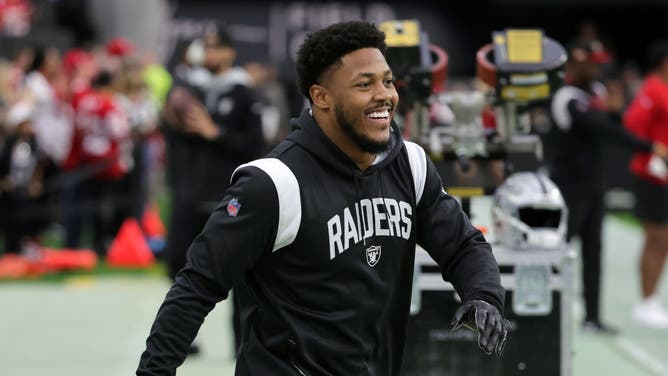 Running back Josh Jacobs of the Las Vegas Raiders warms up before a game against the San Francisco 49ers at Allegiant Stadium on January 01, 2023 in Las Vegas, Nevada.