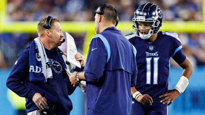 Titans head Coach Mike Vrabel, offensive coordinator Todd Downing and QB Joshua Dobbs talk during a timeout during a game against the Dallas Cowboys at Nissan Stadium in Nashville, Tennessee.