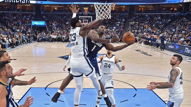 Pelicans forward Zion Williamson attacks basket against Grizzlies big Jaren Jackson Jr. during the game at FedExForum in Memphis, Tennessee.
