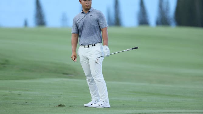 Tom Kim reacts to his approach shot on the 4th hole during the 1st round of the Sentry Tournament of Champions at Plantation Course at Kapalua Golf Club in Lahaina, Hawaii.