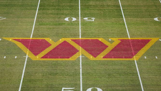 A general view of the Washington Commanders logo on the field before the game between the Washington Commanders and the Cleveland Browns at FedExField on January 1, 2023 in Landover, Maryland.