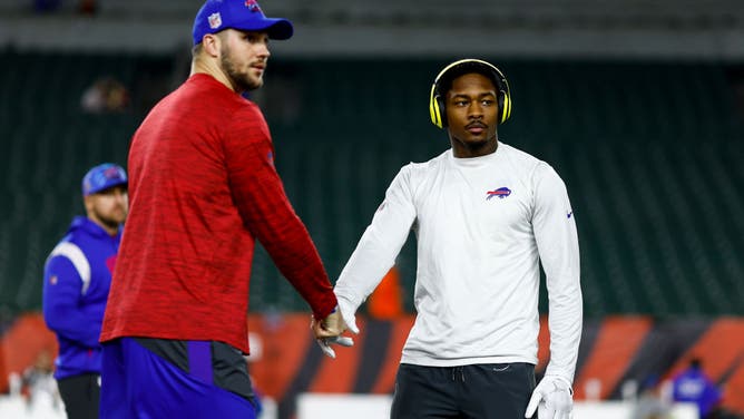 Josh Allen of the Buffalo Bills shakes hands with teammate Stefon Diggs prior to an NFL football game against the Cincinnati Bengals.