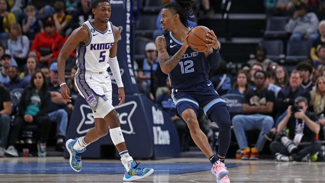 Grizzlies PG Ja Morant handles the ball against the Sacramento Kings in an NBA game at FedExForum in Memphis, Tennessee.