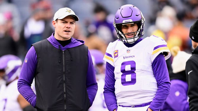 Head coach Kevin O'Connell of the Minnesota Vikings watches during warm-ups alongside quarterback Kirk Cousins prior to the game against the Chicago Bears at Soldier Field on January 08, 2023 in Chicago, Illinois.