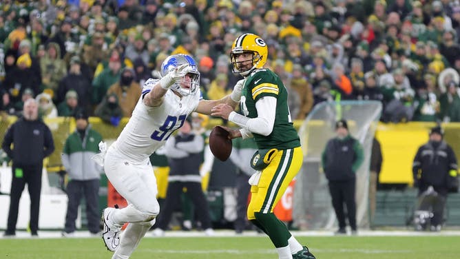 Former Packers QB Aaron Rodgers is sacked by Lions pass rusher Aidan Hutchinson.