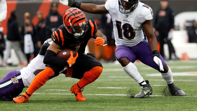 Baltimore Ravens LB Roquan Smith tackles Cincinnati Bengals WR Ja'Marr Chase at Paycor Stadium in Cincinnati, Ohio.