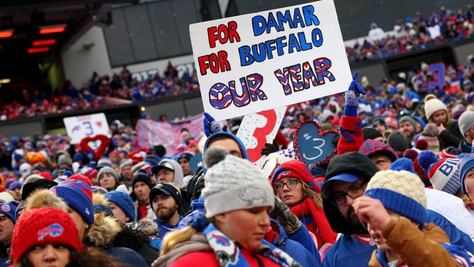 Buffalo Bills' fans holding up a sign honoring DB Damar Hamlin during a game against the New England Patriots at Highmark Stadium in Orchard Park, New York.