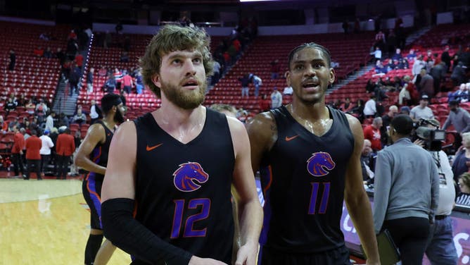 Boise State's Max Rice and Chibuzo Agbo walk off the court after the team's 84-66 victory over the UNLV Rebels at the Thomas & Mack Center in Las Vegas.
