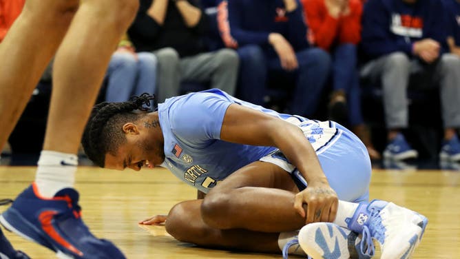 North Carolina Tar Heels C Armando Bacot injures his ankle in the 1st half during a game against the Virginia Cavaliers at John Paul Jones Arena in Charlottesville, Virginia.
