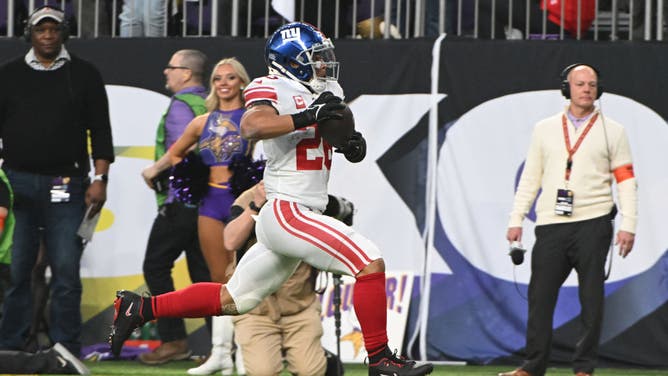 New York Giants RB Saquon Barkley rushes for a TD against the Minnesota Vikings in the NFC Wild Card playoff game at U.S. Bank Stadium in Minneapolis.