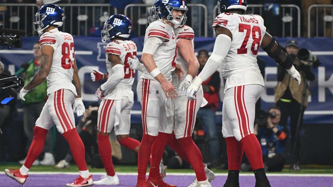 New York Giants QB Daniel Jones celebrates with teammates after a TD against the Minnesota Vikings in the NFC Wild Card playoff game at U.S. Bank Stadium in Minneapolis.