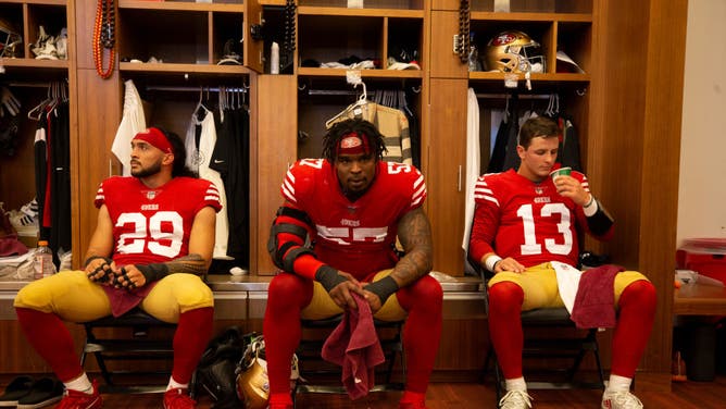 Talanoa Hufanga, Dre Greenlaw and Brock Purdy of the San Francisco 49ers in the locker room before their NFC Wild Card playoff game.