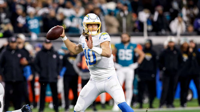 Chargers QB Justin Herbert throws a pass play during the AFC Wild Card game vs. the Jacksonville Jaguars at TIAA Bank Field in Jacksonville, Florida.
