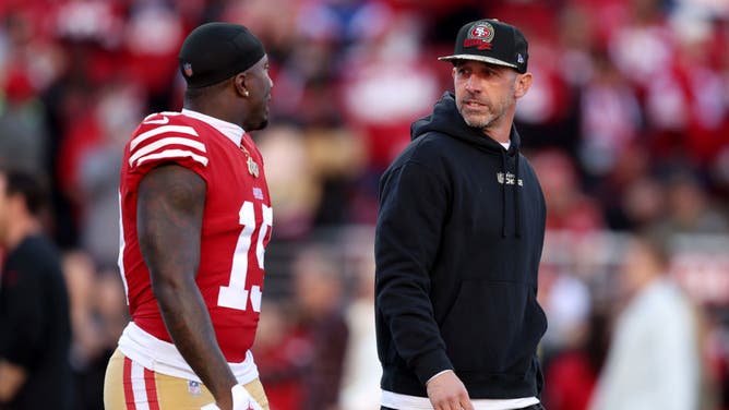 Niners WR Deebo Samuel and coach Kyle Shanahan talk on the field prior to a game vs. the Cowboys in the 2023 NFC Divisional Playoff game at Levi's Stadium in Santa Clara, California.