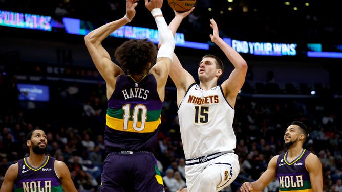 Nuggets big Nikola Jokic shoots over Pelicans big Jaxson Hayes at Smoothie King Center in New Orleans.