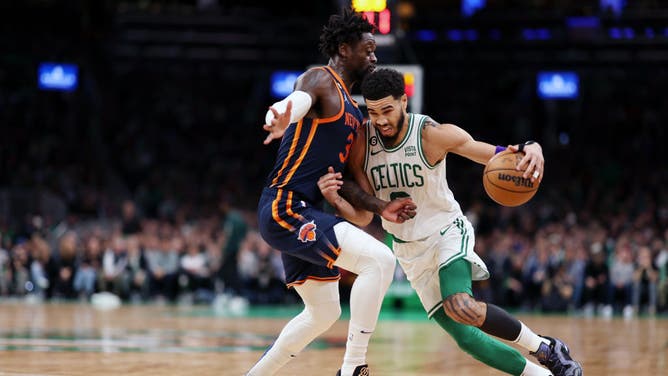Celtics All-Star Jayson Tatum drives to the basket vs. Knicks All-Star Julius Randle at TD Garden in Boston.