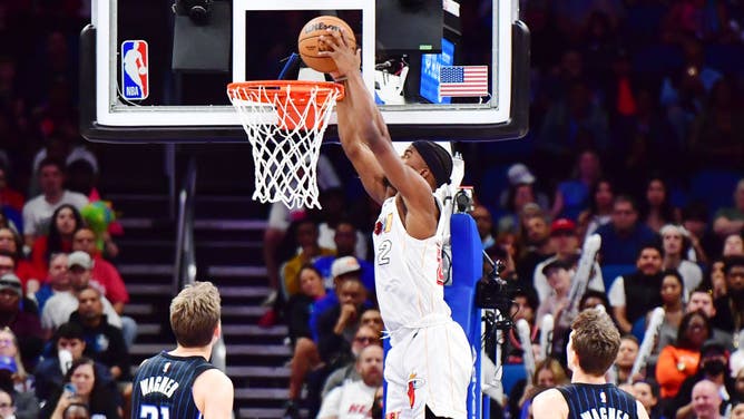 Jimmy Butler dunks the ball on the Magic at Amway Center in Orlando, Florida.