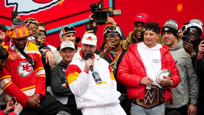Kelce and Chiefs QB Patrick Mahomes celebrate on stage during the Super Bowl LVII victory parade in Kansas City, Missouri.