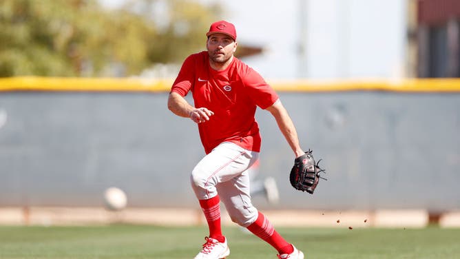 Joey Votto of the Cincinnati Reds fields a ground ball during a spring training workout.