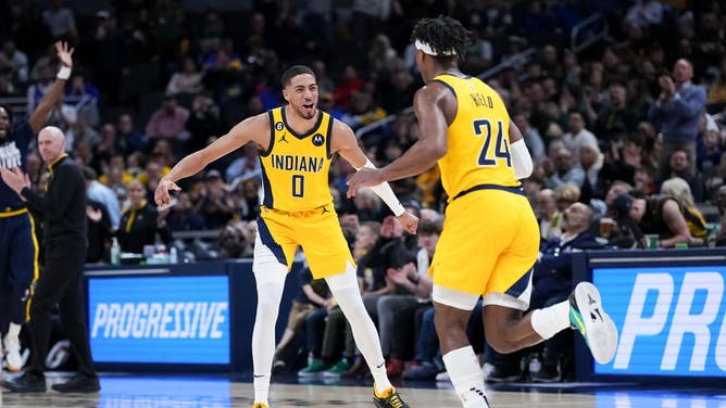 Pacers guards Tyrese Haliburton and Buddy Hield celebrate after a big bucket vs. the Boston Celtics at Gainbridge Fieldhouse in Indianapolis.