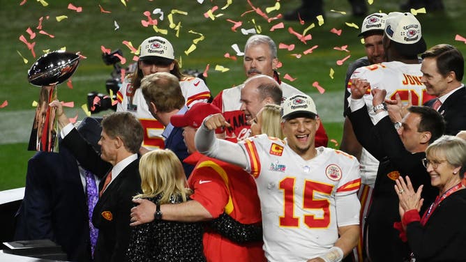 Kansas City Chiefs coach Andy Reid and QB Patrick Mahomes on the Super Bowl LVII podium after defeating the Philadelphia Eagles.