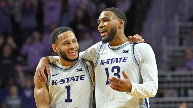 Kansas State guards Desi Sills and Markquis Nowell talk on the court during a game against the Oklahoma Sooners at Bramlage Coliseum in Manhattan, Kansas.
