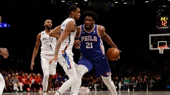 76ers C Joel Embiid posting up Nets C Nic Claxton at Barclays Center in Brooklyn.