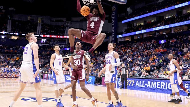 Mississippi State Bulldogs PF Cameron Matthews dunks on the Florida Gators during the 2023 SEC Basketball Tournament at the Bridgestone Arena in Nashville, Tennessee.