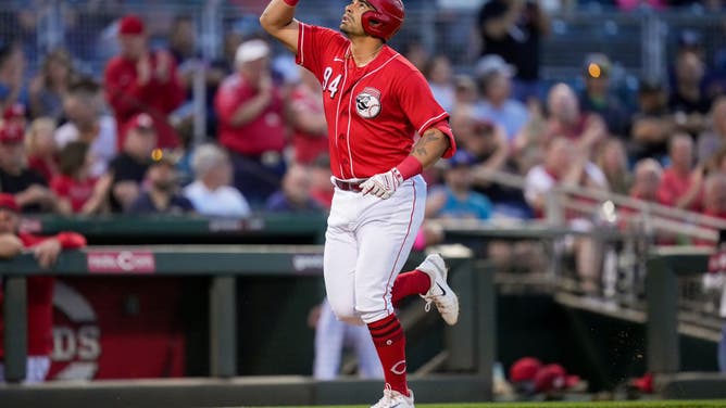 Christian Encarnacion-Strand of the Cincinnati Reds rounds the bases after hitting a home run in the first inning against the Arizona Diamondbacks during a spring training game.