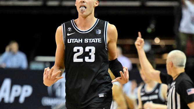 Utah State Aggies PF Taylor Funk reacts after a 3-pointer vs. the San Diego State Aztecs in the Mountain West Conference championship at the Thomas & Mack Center in Las Vegas, Nevada.