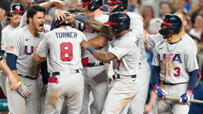 Trea Turner of The United States celebrates with teammates after hitting a grand slam during the eighth inning of a 2023 World Baseball Classic Quarterfinal game against Venezuela.
