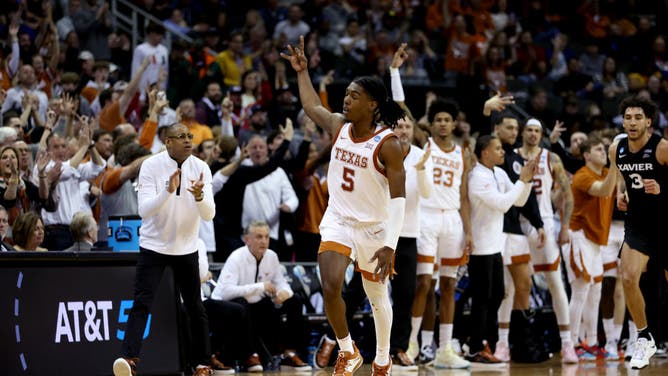 Texas PG Marcus Carr reacts after scoring a 3-pointer vs. the Xavier Musketeers in the Sweet 16 of the NCAA Tournament at T-Mobile Center in Kansas City, Missouri.