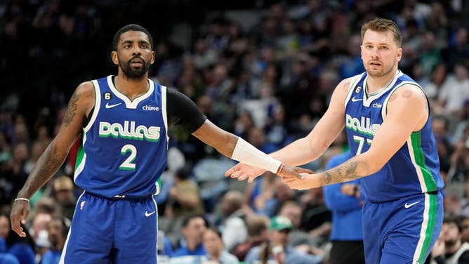 Mavericks G Kyrie Irving high-fives Luka Doncic vs. the Hornets at American Airlines Center in Dallas.