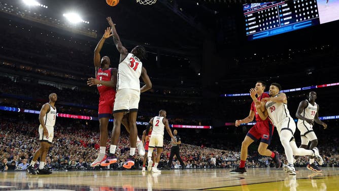 Florida Atlantic G Johnell Davis tries to shoot it over Mensah during the NCAA Men's Basketball Tournament Final Four semifinal game at NRG Stadium in Houston, Texas.