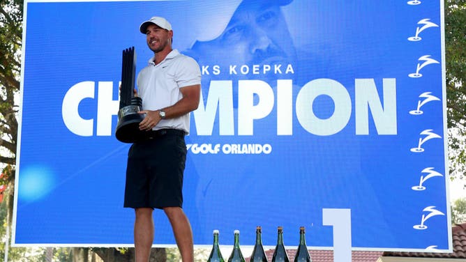 Captain Brooks Koepka of Smash GC celebrates with the trophy  after winning the LIV Golf Invitational - Orlando at The Orange County National on April 02, 2023 in Orlando, Florida.