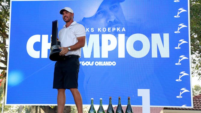 Captain Brooks Koepka of Smash GC celebrates with the trophy  after winning the LIV Golf Invitational - Orlando one week before the Masters.