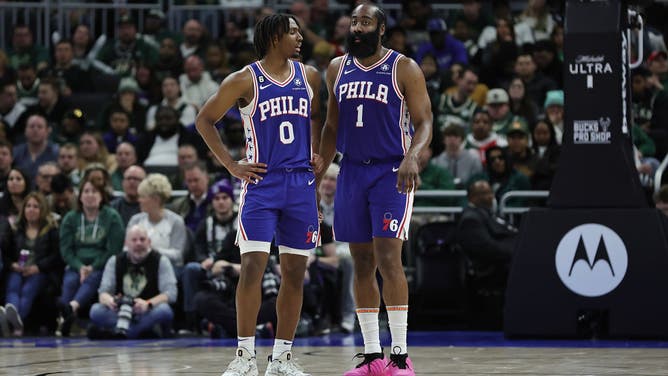 Tyrese Maxey and James Harden huddle during a game vs. the Bucks at Fiserv Forum in Milwaukee, Wisconsin.