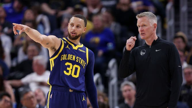 Warriors' Stephen Curry talks to coach Steve Kerr vs. the Oklahoma City Thunder at Chase Center in San Francisco.