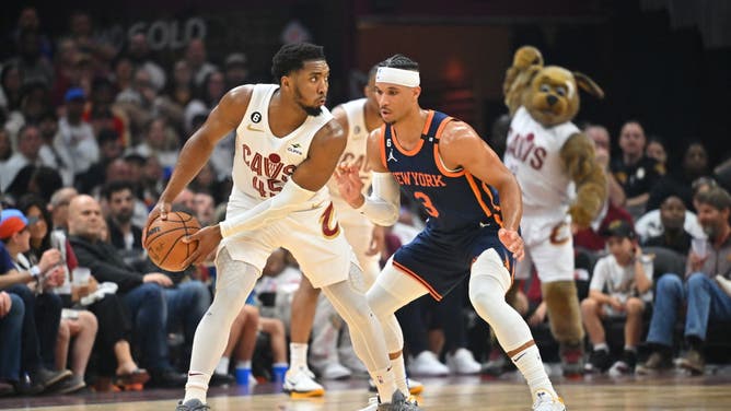 Cavaliers SG Donovan Mitchell posts up New York Knicks wing Josh Hart in the 2023 playoffs at Rocket Mortgage Fieldhouse in Cleveland, Ohio.