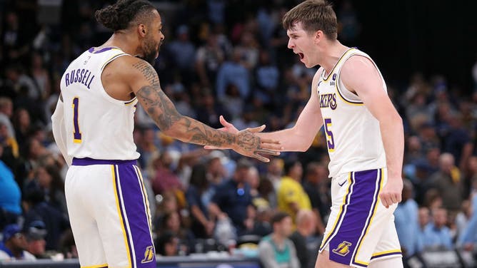 Lakers guards D'Angelo Russell and Austin Reaves are pumped after a big sequence vs. the Grizzlies during the 2023 NBA playoffs at FedExForum in Memphis, Tennessee.